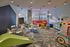 Bright and inviting children's playroom with colorful furniture, cozy seating, and engaging play areas.