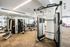 Modern fitness center with state-of-the-art gym equipment and mirrored walls.