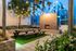 Elegant outdoor seating area with modern fireplace, perfect for relaxing evenings