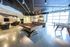 Luxurious apartment recreation lounge featuring a modern pool table, foosball, and sleek bar seating