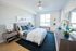 Inviting bedroom with cozy double bed, modern decor, and ample natural light