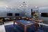 Luxurious and stylish recreational room with a blue pool table, chic lounge seating, and modern decor, ideal for entertainment and relaxation.