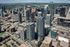 Vibrant cityscape showcasing modern skyscrapers, lively downtown streets, and stunning architecture under a clear blue sky.