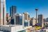 Vibrant cityscape featuring modern skyscrapers under a clear blue sky.