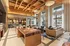 Luxurious apartment lounge featuring modern decor, elegant lighting, and expansive windows for natural light.