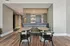Chic dining nook with modern tables, stylish chairs, and elegant wooden flooring in a contemporary apartment.