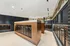Modern and elegant apartment mailroom featuring sleek wooden mailboxes and sophisticated paneling.
