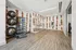 Sleek fitness room with modern exercise equipment, mirrored walls, and stylish decor, perfect for an inspiring workout.