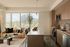 Bright, modern apartment interior with panoramic city views, featuring a cozy living area adjacent to a sleek, fully equipped kitchen.