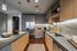 Modern kitchen showcasing sleek cabinetry, stainless steel appliances, and elegant countertops, perfect for culinary enthusiasts.