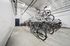 Modern and secure bicycle storage area featuring multiple racks and ample space, perfect for active living.