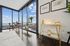 Luxurious city apartment with stunning panoramic views, floor-to-ceiling windows, and elegant dining space.