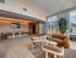 Sophisticated modern lounge with panoramic city views, plush seating, and elegant design elements.