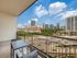 Charming apartment terrace with a stunning urban skyline view, highlighting city living at its best.