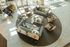 Elegant lounge area featuring plush sofas and armchairs arranged on a stylish round rug, complemented by a grand piano and abundant natural light.
