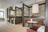 Co-working space with modern design featuring cozy booths, elegant lighting, and stylish decor.