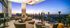 Luxurious sky lounge with modern seating and panoramic city views at sunset.