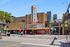 Vibrant urban scene with the iconic State Theatre and bustling street life, showcasing local culture and architecture.