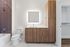 Sleek modern bathroom with wood cabinetry, a well-lit mirror, and a stylish soaking tub.