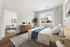 Bright, modern bedroom with chic decor, featuring a cozy sitting area and scenic window view.