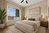 Bright and elegant bedroom with a comfortable bed, large window view, and stylish furnishings.