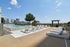 Luxurious rooftop infinity pool with sun loungers, offering stunning city skyline views and a relaxing oasis ambiance.