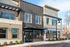 Modern apartment building exterior with stylish architecture at The Atwood, featuring large windows and inviting entrance.