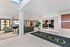 Luxurious apartment lobby featuring elegant seating, modern decor, and a welcoming ambiance with natural lighting.