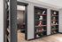 Elegant apartment interior showcasing stylish built-in shelves with decorative accents and a glimpse into a sophisticated dining area.