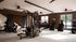 Modern fitness center with state-of-the-art exercise equipment, including treadmills, weight machines, and ample natural light.