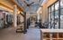 Modern fitness center with state-of-the-art equipment and large windows for natural light.