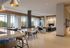 Luxurious open-concept living area with modern decor, spacious seating, and floor-to-ceiling windows offering stunning natural views.