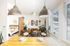 Comfortable living area with modern decor and natural lighting.