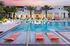 Shimmering pool with cabanas and luxurious seating