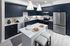 Modern quartz countertops and tile backsplash