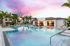 Shimmering pool and cabanas