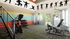 Modern fitness center featuring vibrant wall art, state-of-the-art exercise equipment, and a welcoming atmosphere.