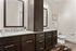 Elegant bathroom with granite countertops, dual sinks, and stylish dark wood cabinetry.