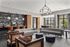 Elegant communal lounge with stylish sofas, modern decor, and vibrant artwork, ideal for social gatherings and relaxation.