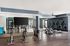 Sleek modern gym with stylish spin bikes and state-of-the-art exercise equipment, ideal for fitness enthusiasts.