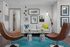 Chic living room with elegant furniture including a modern sofa, stylish chairs, and vibrant decor, creating a welcoming atmosphere.
