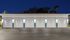 Well-lit row of modern garage doors with clean and stylish design.