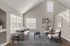 Bright and inviting living room with vaulted ceilings, modern furniture, and elegant decor.