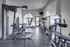 Modern fitness center with high-quality gym equipment, featuring strength machines and cardio gear in a bright, inviting space.