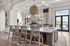 Indoor community area with a large table and chairs with floral decor
