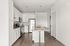 Furnished Kitchen with kitchen island, white cabinets, and stainless steel appliances