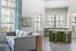 Bright living space with modern furnishings, large windows, and airy decor.
