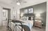 Modern bedroom with a cozy bed, stylish decor, bedside lamps, and a spacious walk-in closet leading to an elegant bathroom.