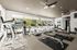 Bright and modern fitness center with treadmills and exercise machines overlooking scenic outdoor views.