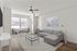 Furnished livingroom with grey sectional couch and nook with large window and sitting chairs